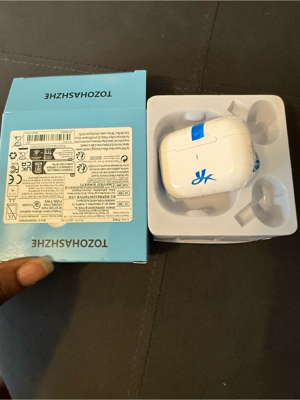White Wireless Earbuds Charging Case with Blue Accent